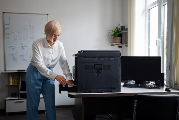 Woman using HP printer in Dubai office
